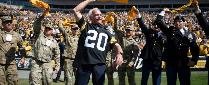 Steelers Legend Rocky Bleier leading the Terrible Towel Twirl with members of the US military